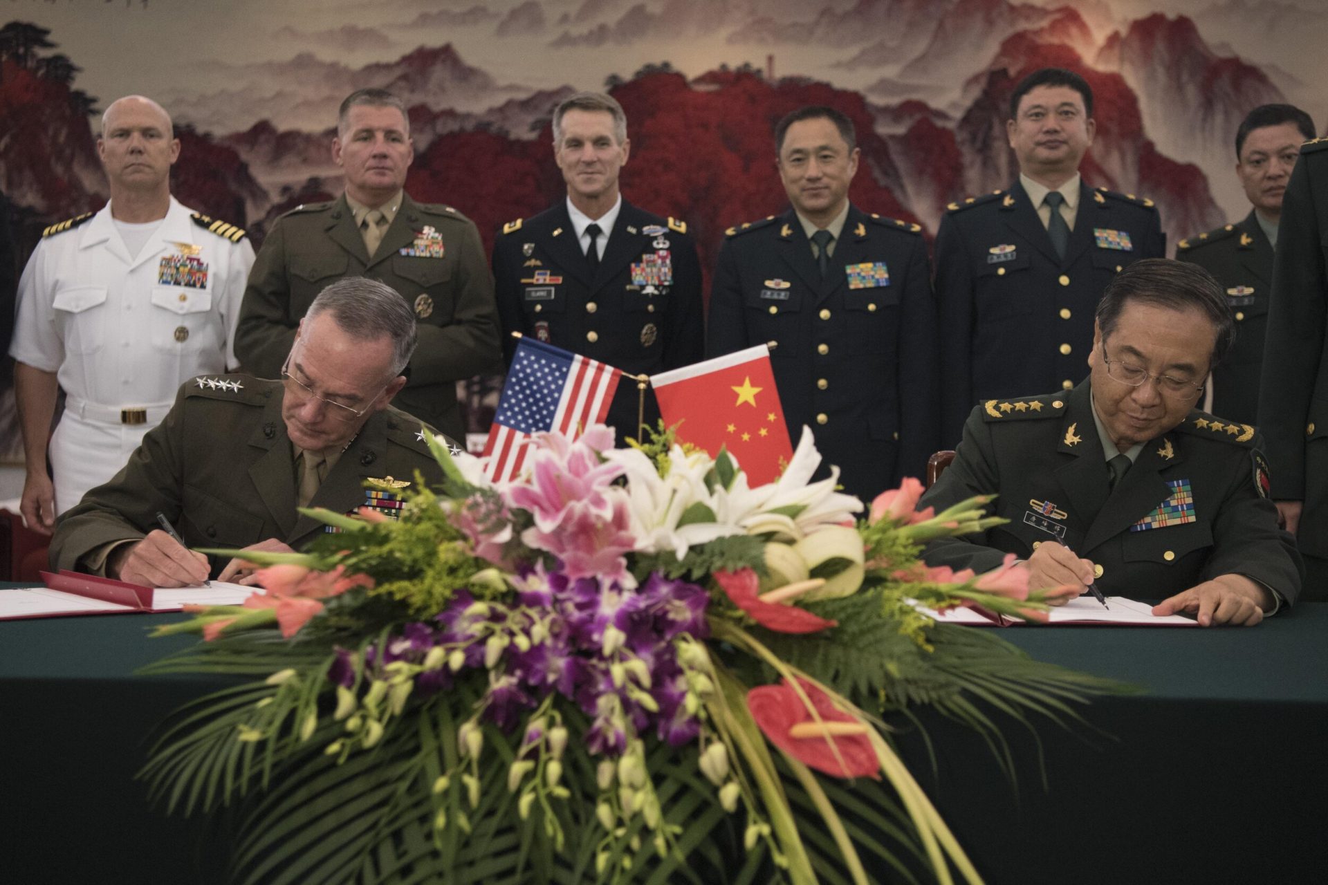 August 15, 2017 – Marine Corps Gen. Joseph F. Dunford Jr., chairman of the Joint Chiefs of Staff, signs the Joint Staff Dialogue Mechanism with his Chinese counterpart Gen. Fang Fenghui following a roundtable discussion at the Ba Yi. (Photo by U.S. Navy Petty Officer 1st Class Dominique A. Pineiro | Department of Defense)