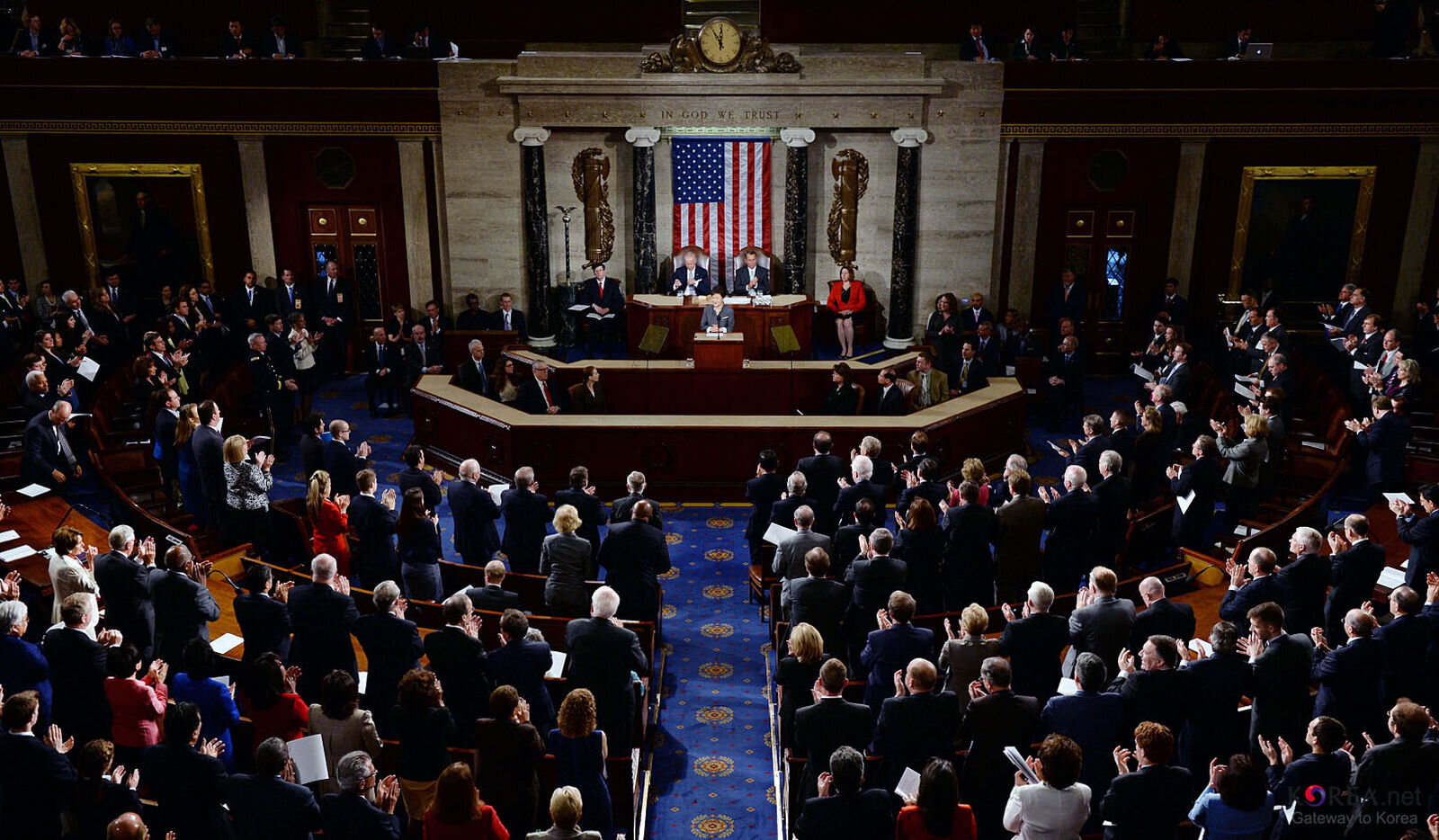 President Park Geun-hye (bottom left), Vice President Joe Biden (top left), and House Speaker John Boehner (right) give a standing ovation to a Korean War veteran family after President Park introduced them on Capitol Hill in Washington, D.C. May 8.…