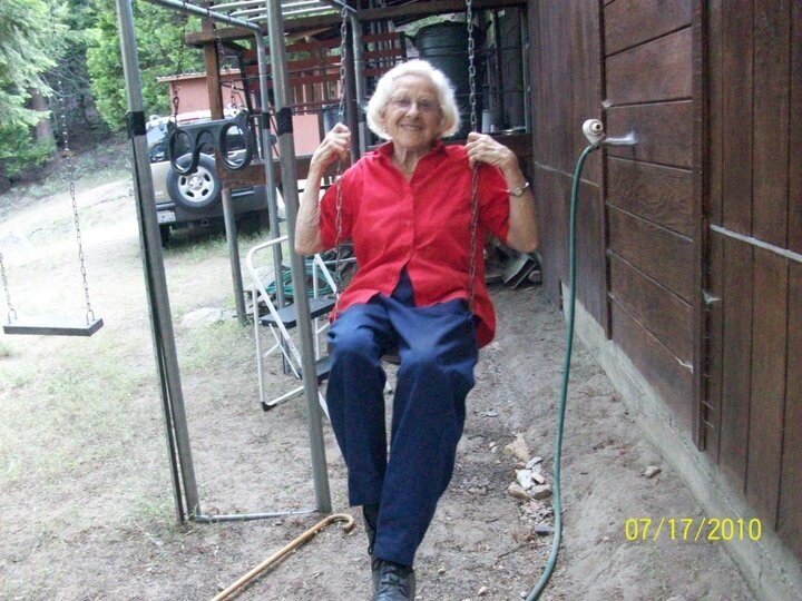 The author’s mother on a swing outside of the family cabin.