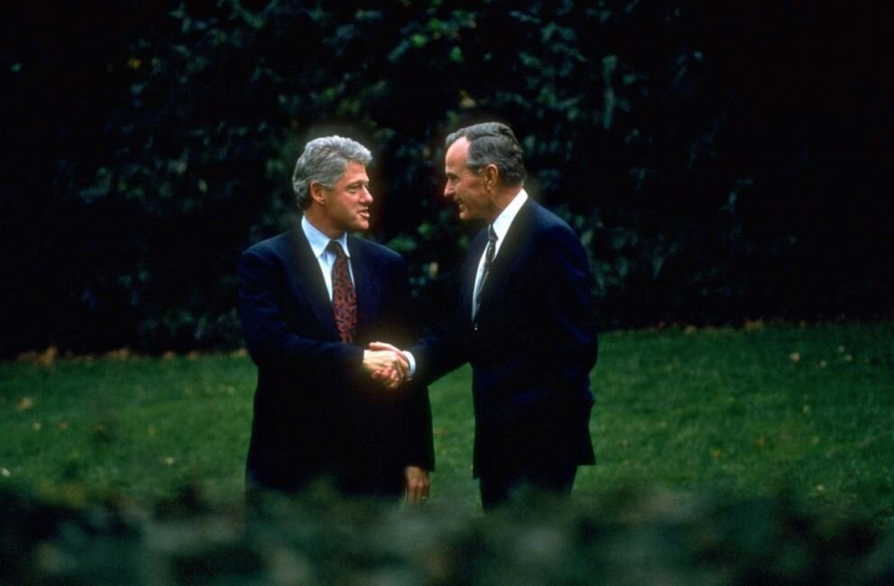 President George Bush and President-elect Bill Clinton shake hands during a stroll around the White House grounds, in a post-election visit by Clinton, Nov. 1, 1992. (Photo by Cynthia Johnson | The LIFE Images Collection)