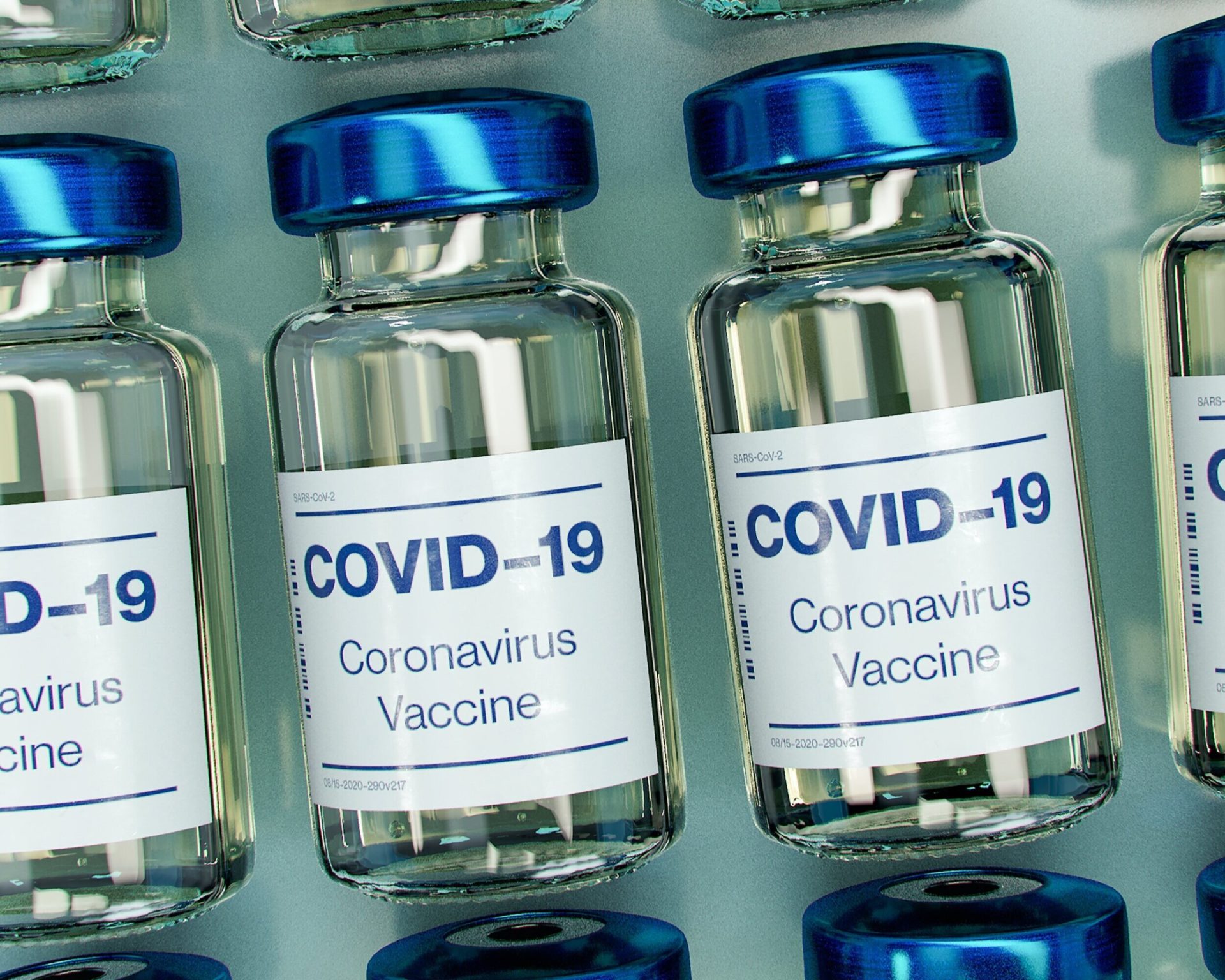 COVID-19 Vaccine Bottle Mockup (Photo by Daniel Schludi | Unsplash)