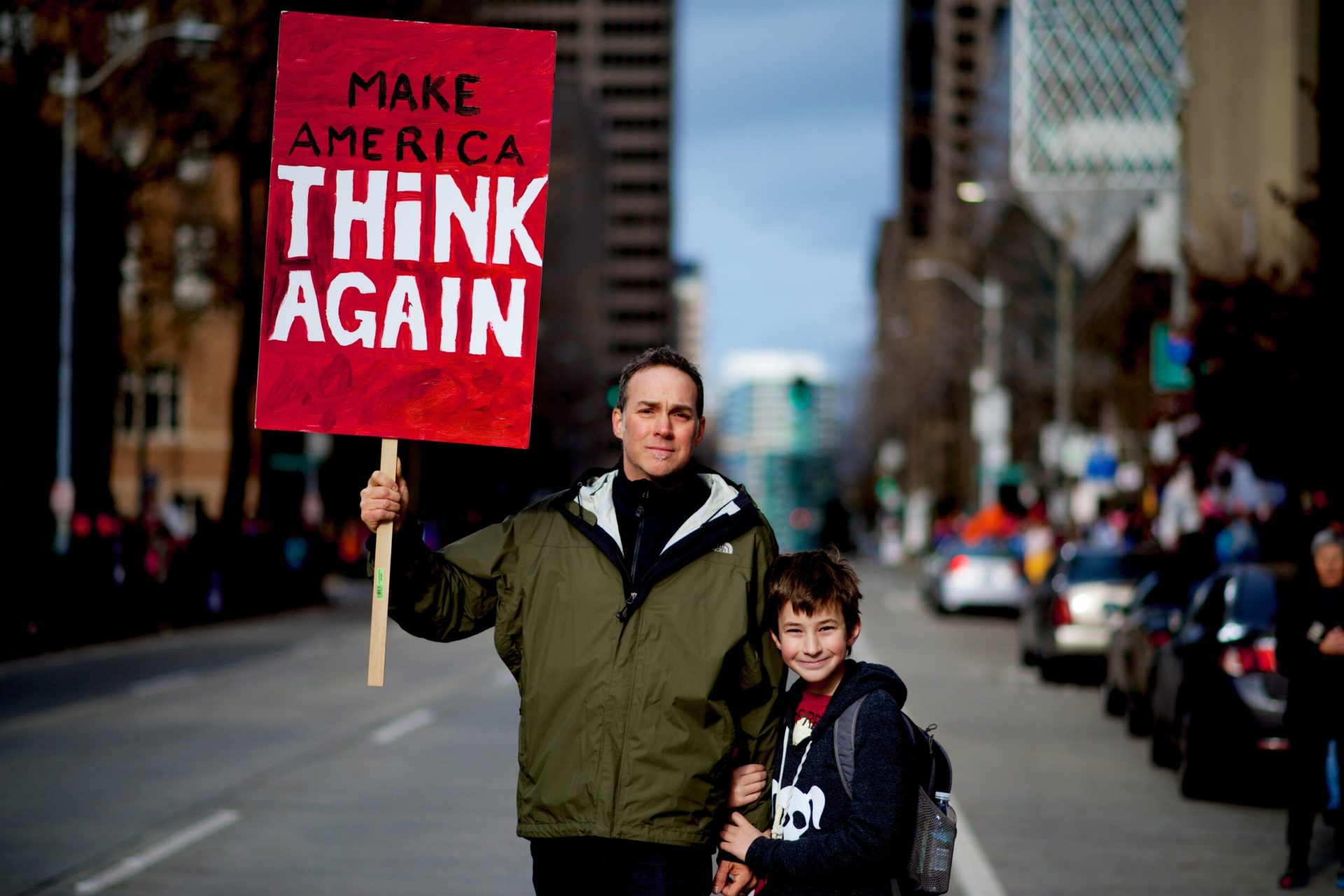 A father and son protest in Seattle, WA. USA. (Photo by Jose M., Unsplash)