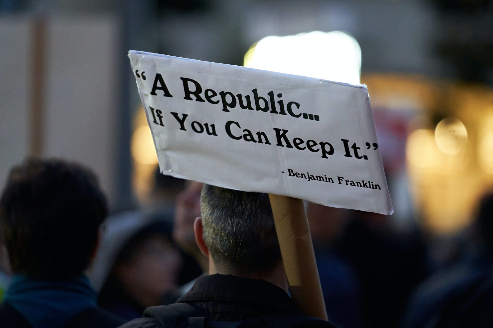 December 17, 2019 - A protester holds a sign reading "A Republic... If You Can Keep It. - Benjamin Franklin" in front of House Speaker Nancy Pelosi's offices (she was in Washington at the time) in support of the impeachment of President Donald Trump…