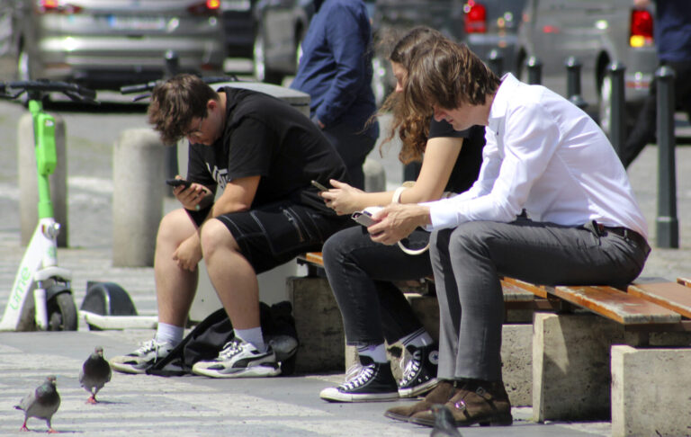 young people, addicted to smartphones, mobile, Wenceslas Square, city center Prague