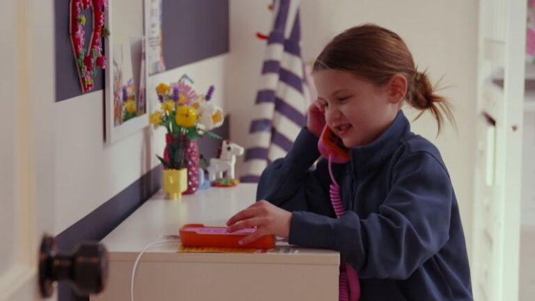 Kid using landline.